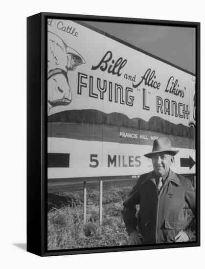 Super Rich Texas Millionaires William Likins Standing in Front of Sign at Main Entrance to Ranch-Michael Rougier-Framed Premier Image Canvas