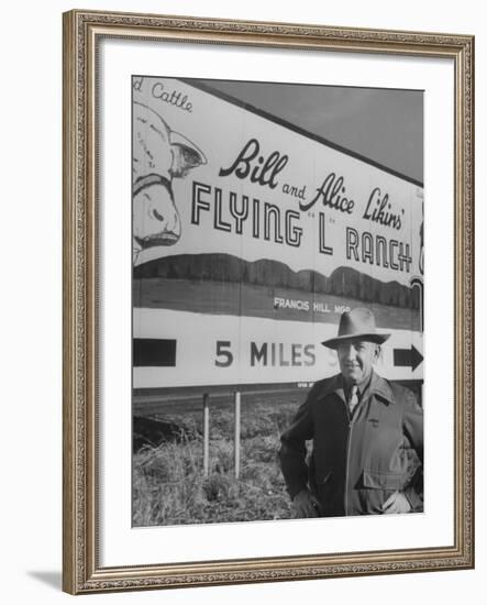 Super Rich Texas Millionaires William Likins Standing in Front of Sign at Main Entrance to Ranch-Michael Rougier-Framed Premium Photographic Print