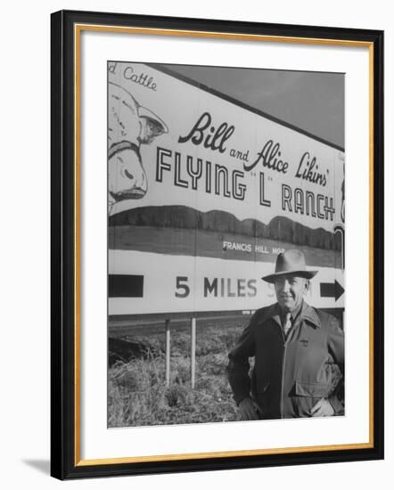 Super Rich Texas Millionaires William Likins Standing in Front of Sign at Main Entrance to Ranch-Michael Rougier-Framed Premium Photographic Print