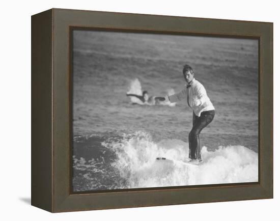 Surfer Riding a Wave While Wearing a Tuxedo-Allan Grant-Framed Premier Image Canvas