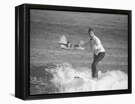 Surfer Riding a Wave While Wearing a Tuxedo-Allan Grant-Framed Premier Image Canvas