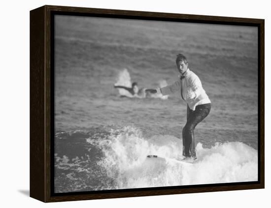 Surfer Riding a Wave While Wearing a Tuxedo-Allan Grant-Framed Premier Image Canvas