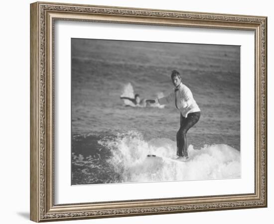 Surfer Riding a Wave While Wearing a Tuxedo-Allan Grant-Framed Photographic Print