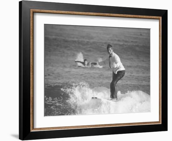 Surfer Riding a Wave While Wearing a Tuxedo-Allan Grant-Framed Photographic Print