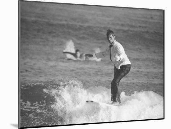 Surfer Riding a Wave While Wearing a Tuxedo-Allan Grant-Mounted Photographic Print