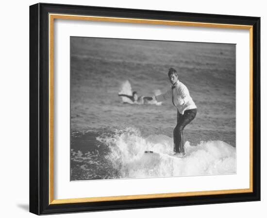 Surfer Riding a Wave While Wearing a Tuxedo-Allan Grant-Framed Photographic Print