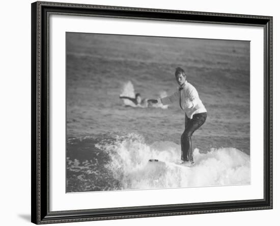 Surfer Riding a Wave While Wearing a Tuxedo-Allan Grant-Framed Photographic Print
