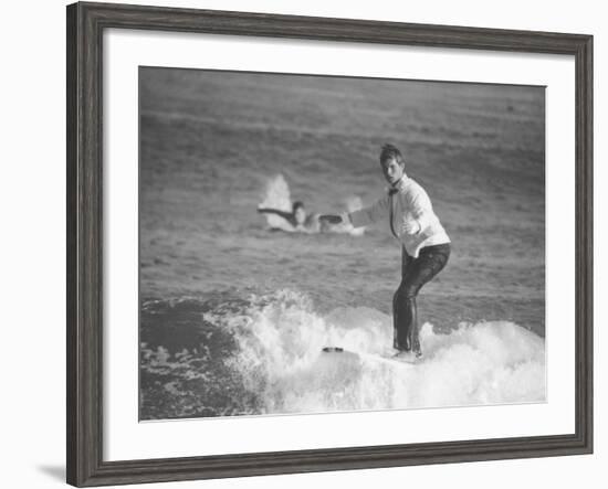 Surfer Riding a Wave While Wearing a Tuxedo-Allan Grant-Framed Photographic Print