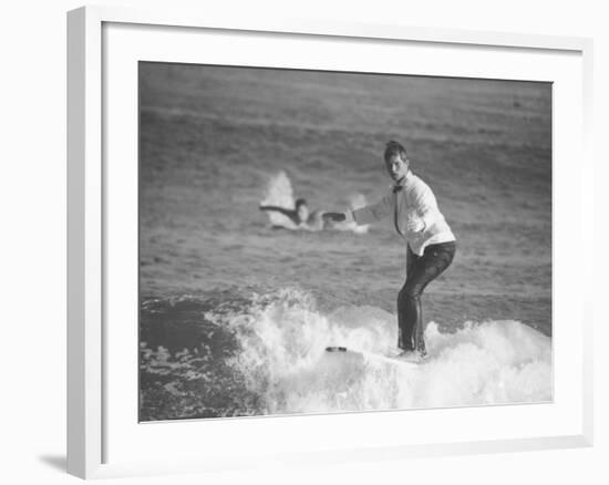 Surfer Riding a Wave While Wearing a Tuxedo-Allan Grant-Framed Photographic Print