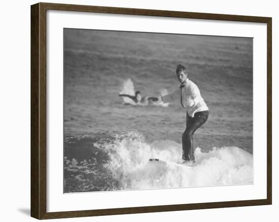 Surfer Riding a Wave While Wearing a Tuxedo-Allan Grant-Framed Photographic Print