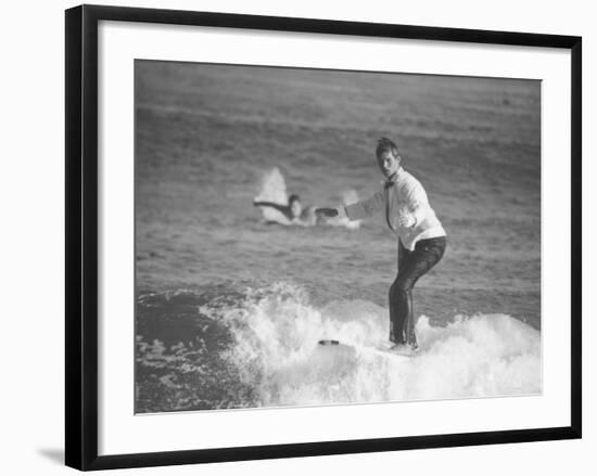 Surfer Riding a Wave While Wearing a Tuxedo-Allan Grant-Framed Photographic Print