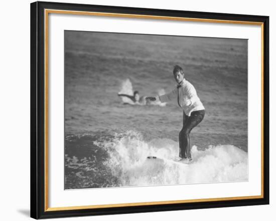 Surfer Riding a Wave While Wearing a Tuxedo-Allan Grant-Framed Photographic Print