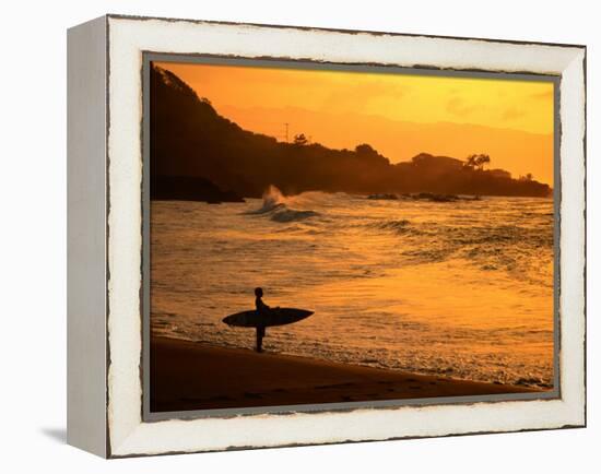 Surfer Standing at Waimea Bay at Sunset, Waimea, U.S.A.-Ann Cecil-Framed Premier Image Canvas