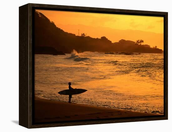 Surfer Standing at Waimea Bay at Sunset, Waimea, U.S.A.-Ann Cecil-Framed Premier Image Canvas