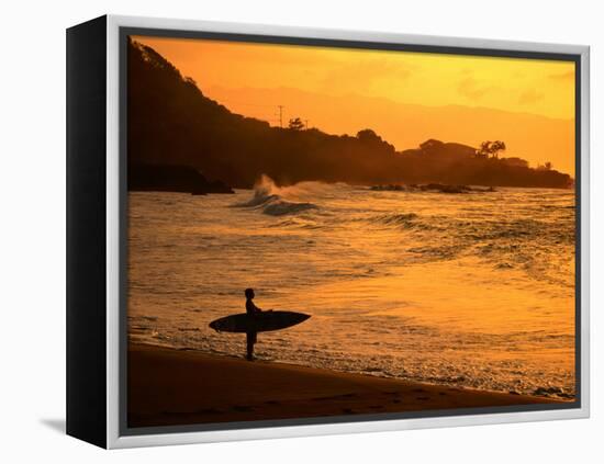 Surfer Standing at Waimea Bay at Sunset, Waimea, U.S.A.-Ann Cecil-Framed Premier Image Canvas