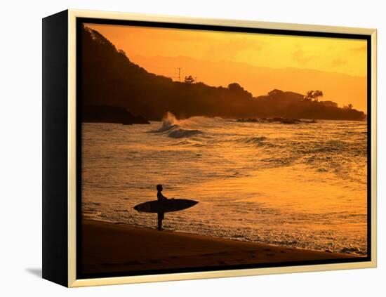 Surfer Standing at Waimea Bay at Sunset, Waimea, U.S.A.-Ann Cecil-Framed Premier Image Canvas