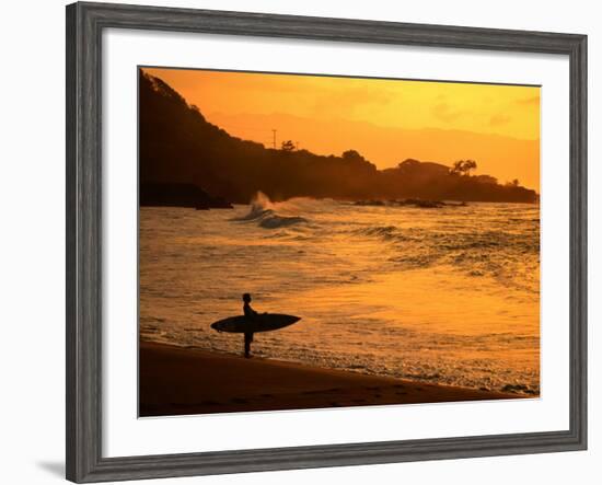 Surfer Standing at Waimea Bay at Sunset, Waimea, U.S.A.-Ann Cecil-Framed Photographic Print