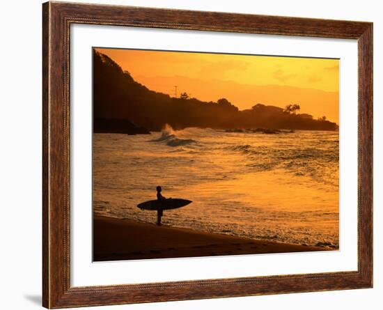 Surfer Standing at Waimea Bay at Sunset, Waimea, U.S.A.-Ann Cecil-Framed Photographic Print