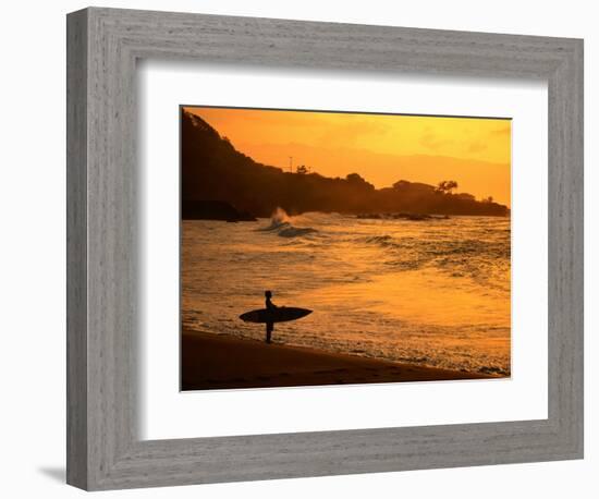 Surfer Standing at Waimea Bay at Sunset, Waimea, U.S.A.-Ann Cecil-Framed Photographic Print