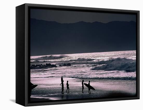 Surfers at Sunset, Ehukai, Oahu, Hawaii-Bill Romerhaus-Framed Premier Image Canvas