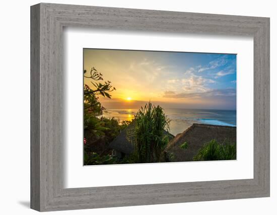 Surfers at sunset in Bali with straw roofed huts, Indonesia, Southeast Asia, Asia-Tyler Lillico-Framed Photographic Print