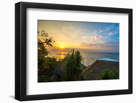 Surfers at sunset in Bali with straw roofed huts, Indonesia, Southeast Asia, Asia-Tyler Lillico-Framed Photographic Print