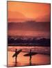 Surfers at Sunset, Oahu, Hawaii-Bill Romerhaus-Mounted Photographic Print