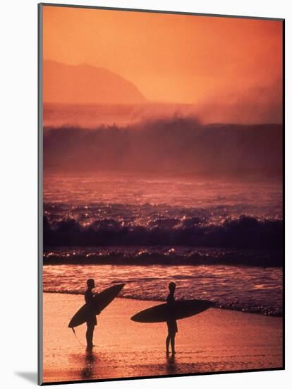 Surfers at Sunset, Oahu, Hawaii-Bill Romerhaus-Mounted Photographic Print