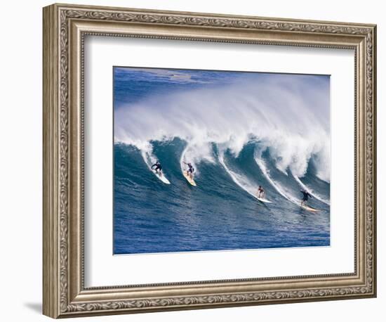 Surfers Ride a Wave at Waimea Beach on the North Shore of Oahu, Hawaii-null-Framed Photographic Print