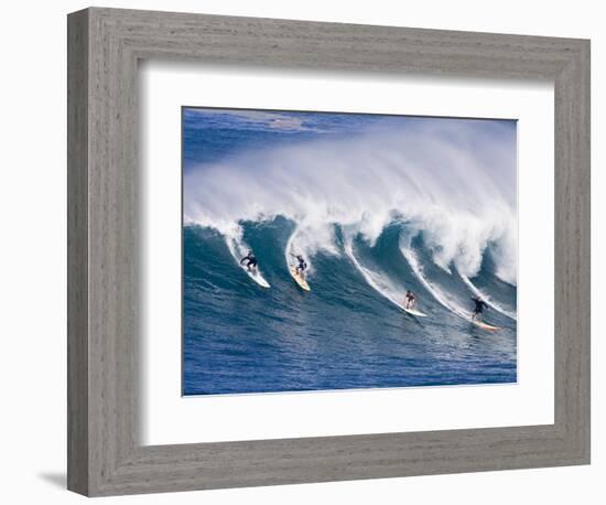 Surfers Ride a Wave at Waimea Beach on the North Shore of Oahu, Hawaii-null-Framed Photographic Print