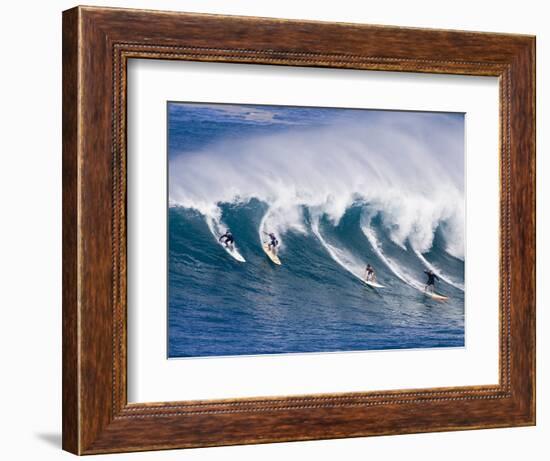 Surfers Ride a Wave at Waimea Beach on the North Shore of Oahu, Hawaii-null-Framed Photographic Print