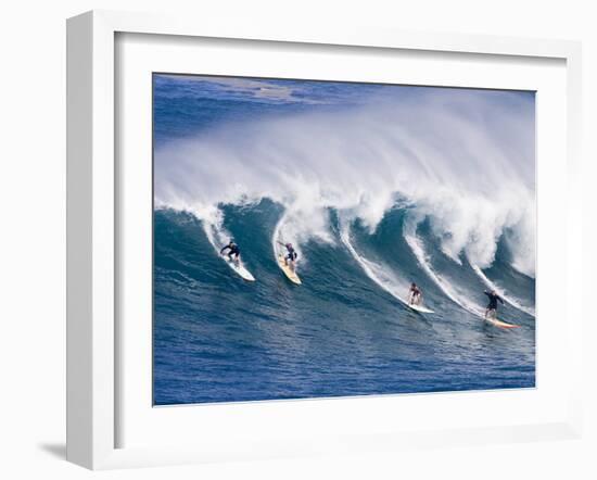 Surfers Ride a Wave at Waimea Beach on the North Shore of Oahu, Hawaii-null-Framed Photographic Print