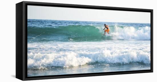 Surfers surfing on a beach, Nosara, Guanacaste Province, Pacific Coast, Costa Rica-Matthew Williams-Ellis-Framed Stretched Canvas