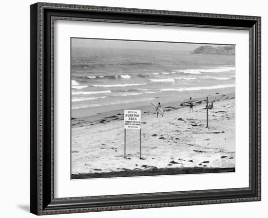 Surfers Walking to Water Behind Sign Reading "Official Surfing Area"-Allan Grant-Framed Photographic Print