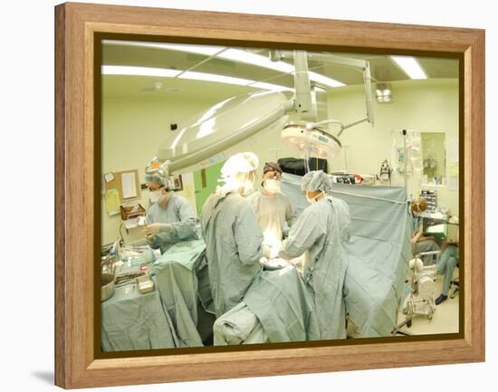 Surgeons Performing Operation-null-Framed Premier Image Canvas