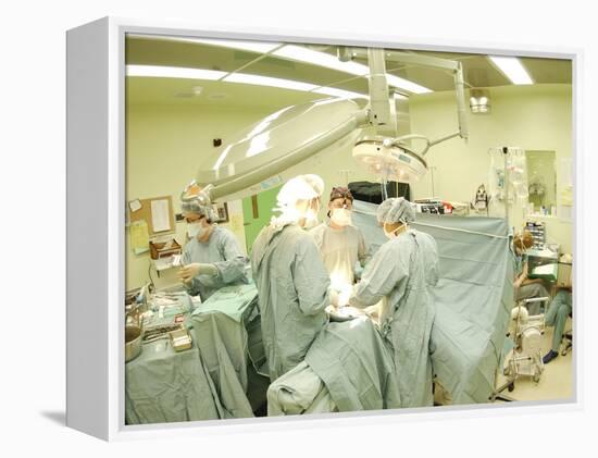 Surgeons Performing Operation-null-Framed Premier Image Canvas