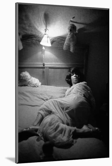 Surrounded by toy-animals, a Berlin stripper settles down for a quiet night.-Erich Lessing-Mounted Photographic Print