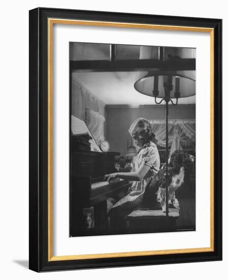 Suzy Creech, Typical Girl Known as a "Pigtailer" at Home Playing the Piano-Frank Scherschel-Framed Photographic Print