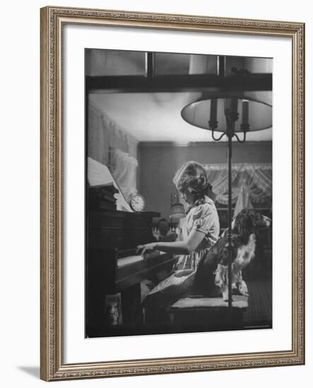 Suzy Creech, Typical Girl Known as a "Pigtailer" at Home Playing the Piano-Frank Scherschel-Framed Photographic Print