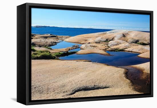 Sweden, Bohuslan, Ramsviklandet Nature Preserve. Polished rock slabs along the coast.-Fredrik Norrsell-Framed Premier Image Canvas