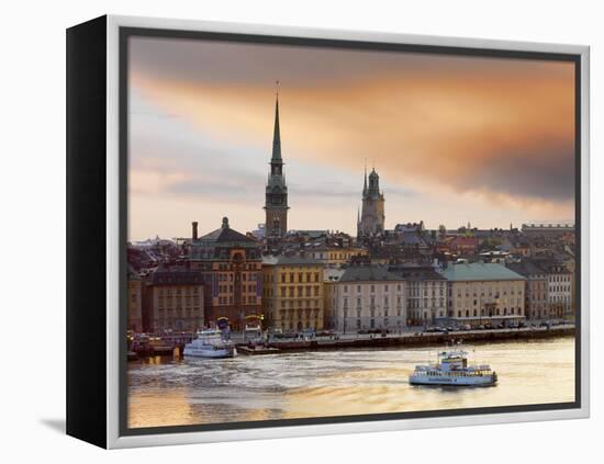 Sweden, Stockholm, Riddarfjarden, Gamla Stan, Passenger Ferries in Bay at Dusk-Shaun Egan-Framed Premier Image Canvas