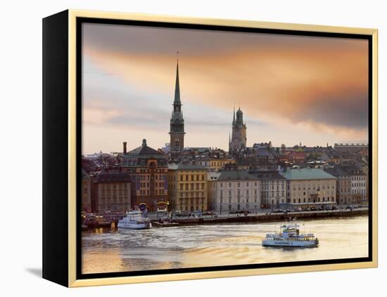 Sweden, Stockholm, Riddarfjarden, Gamla Stan, Passenger Ferries in Bay at Dusk-Shaun Egan-Framed Premier Image Canvas