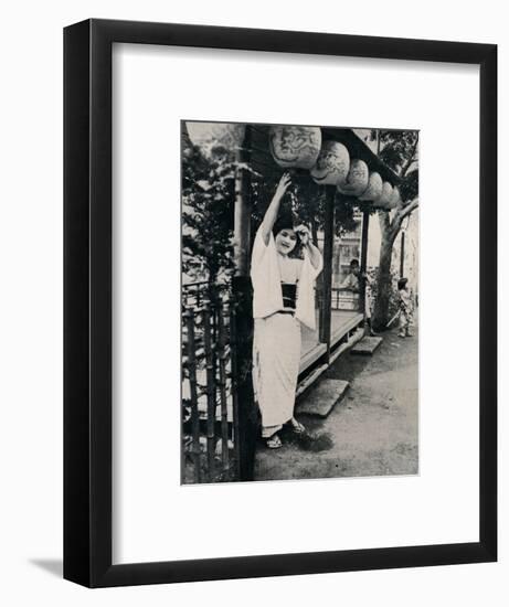 'Sweet natured smile of tea-house maid, called nesan - elder sister', c1900, (1921)-Julian Leonard Street-Framed Photographic Print