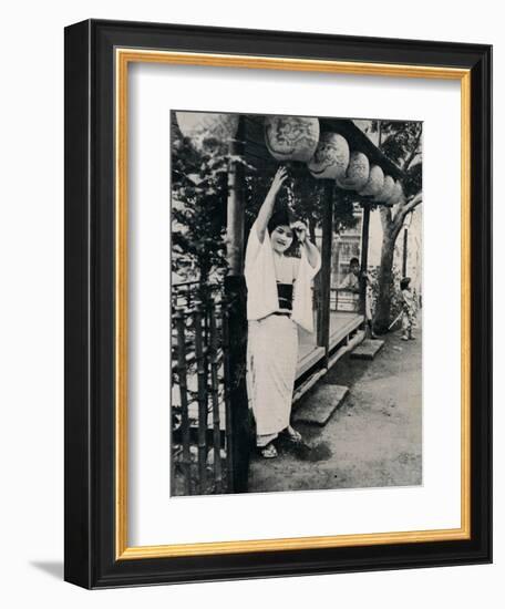 'Sweet natured smile of tea-house maid, called nesan - elder sister', c1900, (1921)-Julian Leonard Street-Framed Photographic Print