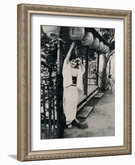 'Sweet natured smile of tea-house maid, called nesan - elder sister', c1900, (1921)-Julian Leonard Street-Framed Photographic Print