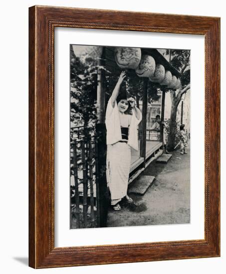 'Sweet natured smile of tea-house maid, called nesan - elder sister', c1900, (1921)-Julian Leonard Street-Framed Photographic Print