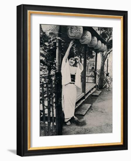 'Sweet natured smile of tea-house maid, called nesan - elder sister', c1900, (1921)-Julian Leonard Street-Framed Photographic Print