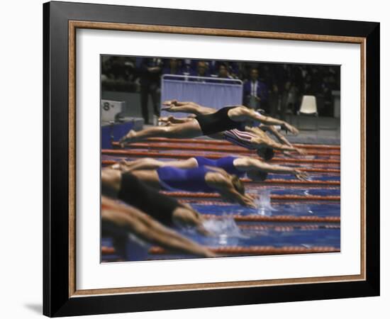 Swimmers Diving to Start a Race at Summer Olympics-null-Framed Photographic Print