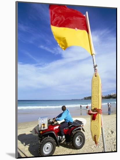 Swimming Flag and Patrolling Lifeguard at Bondi Beach, Sydney, New South Wales, Australia-Robert Francis-Mounted Photographic Print