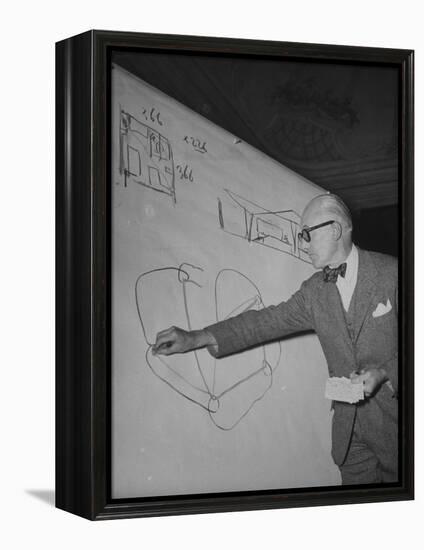 Swiss Architect Le Corbusier Standing on Stage with Notes in His Hand and Drawing on Sketch Pad-null-Framed Premier Image Canvas